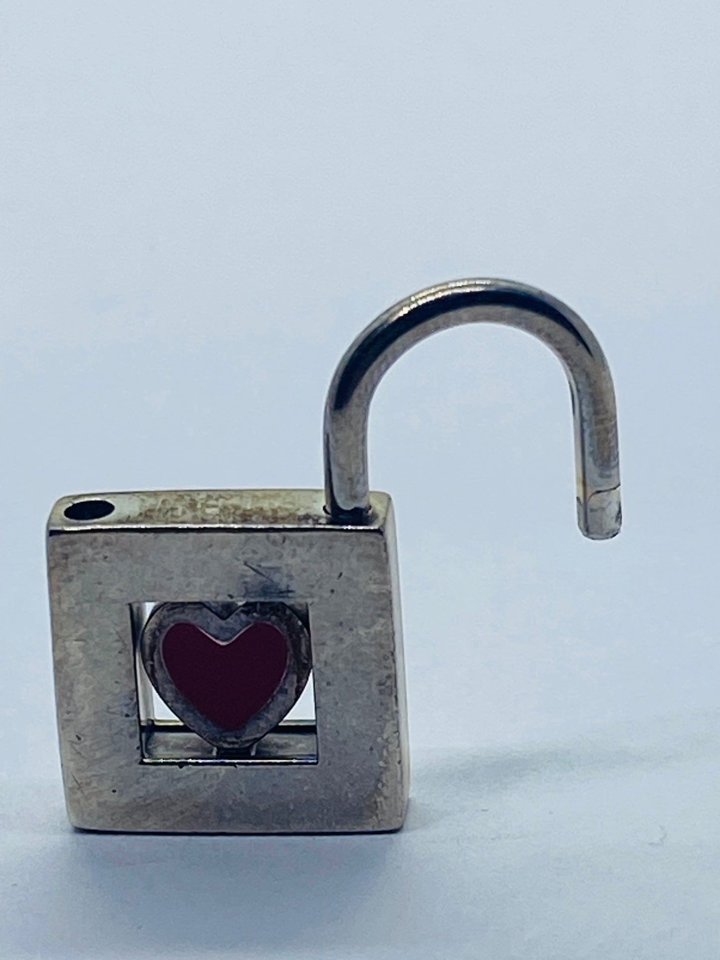 TIFFANY & CO. Red Heart Padlock Charm Sterling Silver Pendant.