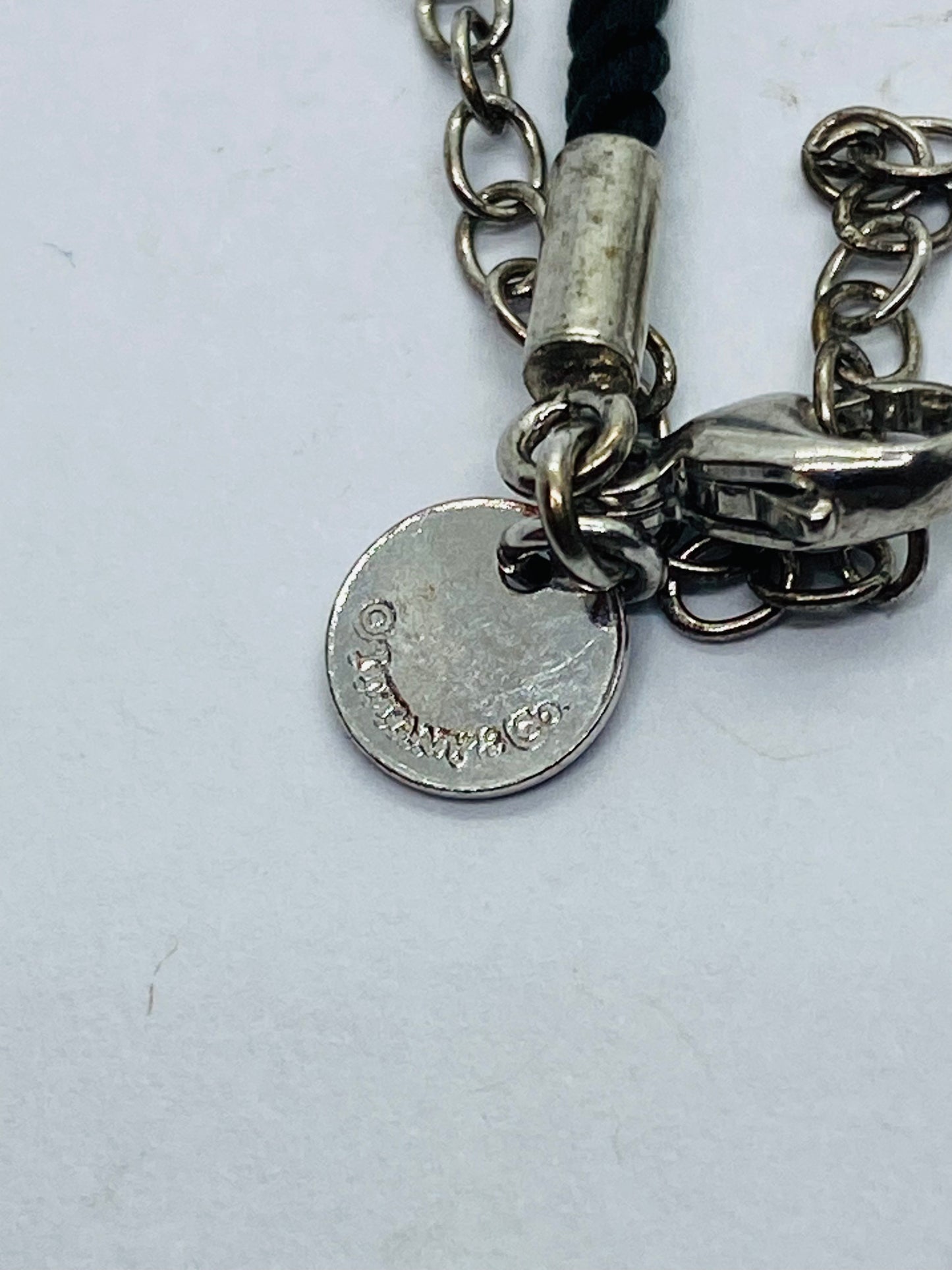 Tiffany & Co White Bone Script New York Fifth Ave Round Silk Cord 16" Necklace