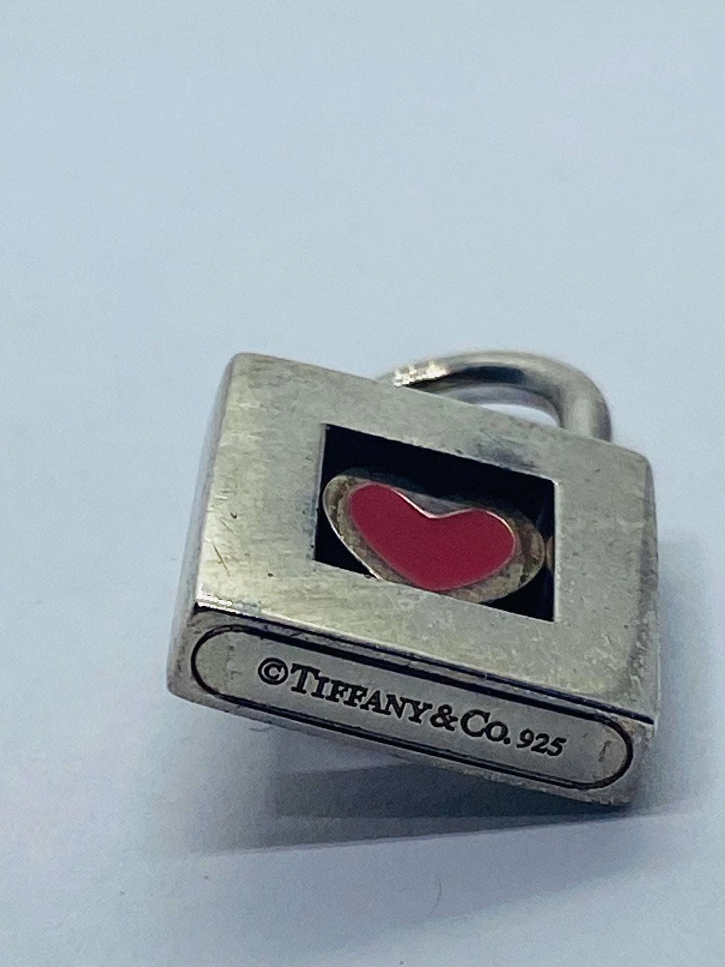 TIFFANY & CO. Red Heart Padlock Charm Sterling Silver Pendant.