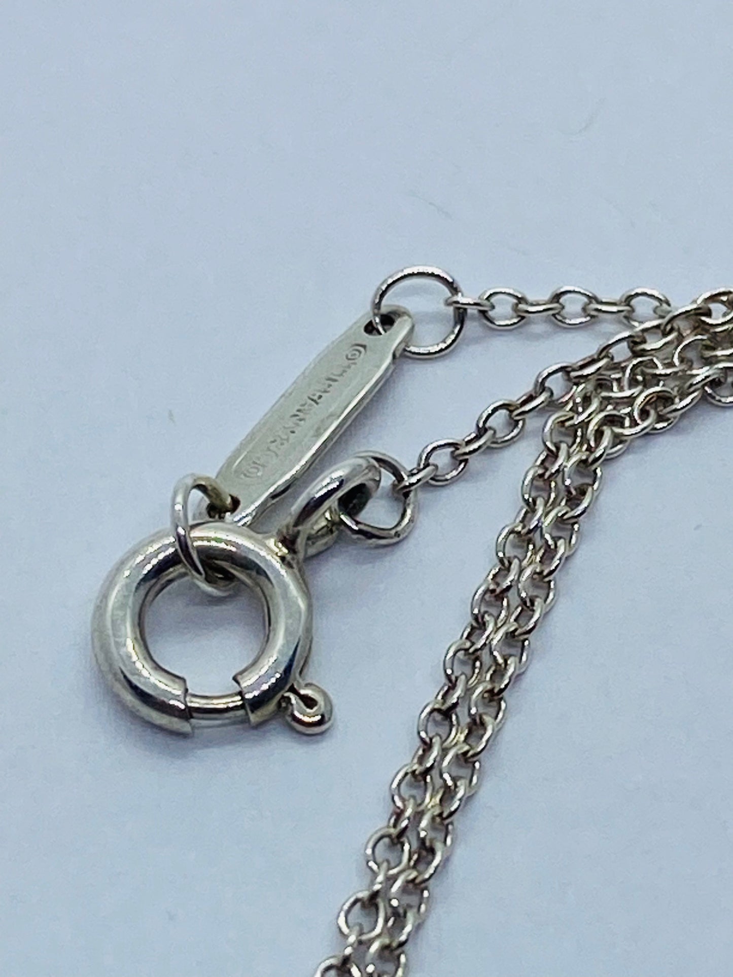Return to Tiffany & Co. Blue Enamel Font/Writing Heart Charm Sterling Silver