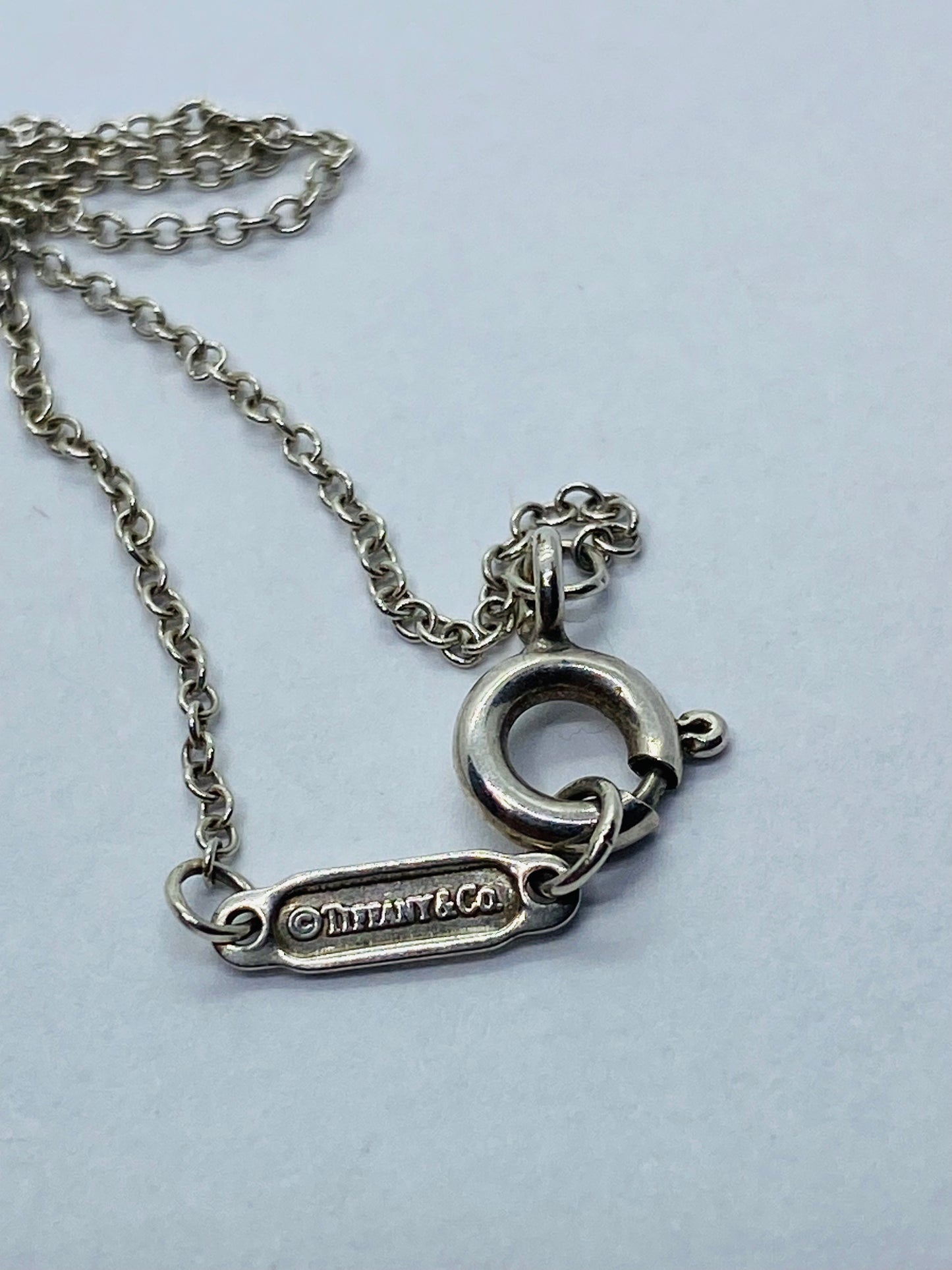 Return to Tiffany & Co. Blue Enamel Font/Writing Heart Charm Sterling Silver