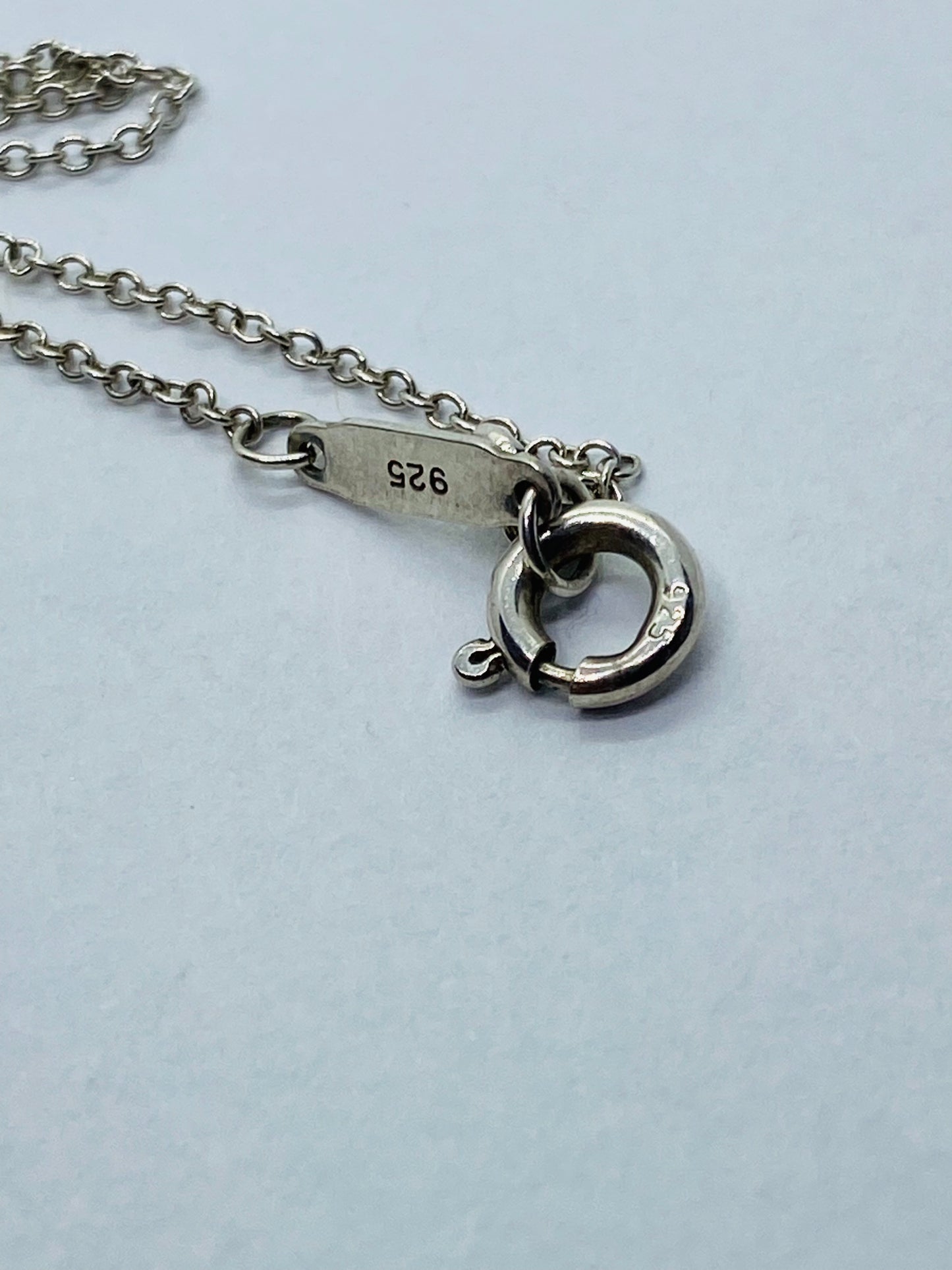 Return to Tiffany & Co. Blue Enamel Font/Writing Heart Charm Sterling Silver