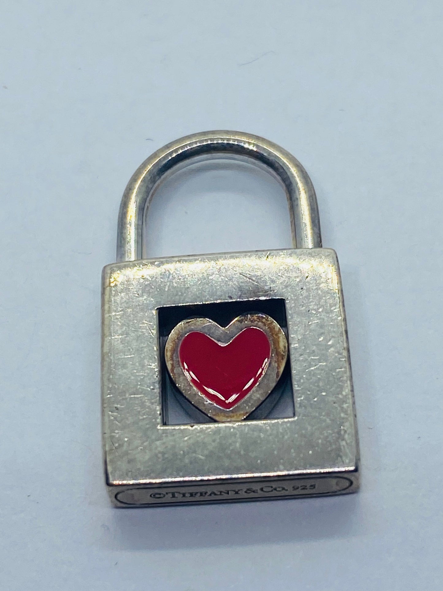 TIFFANY & CO. Red Heart Padlock Charm Sterling Silver Pendant.