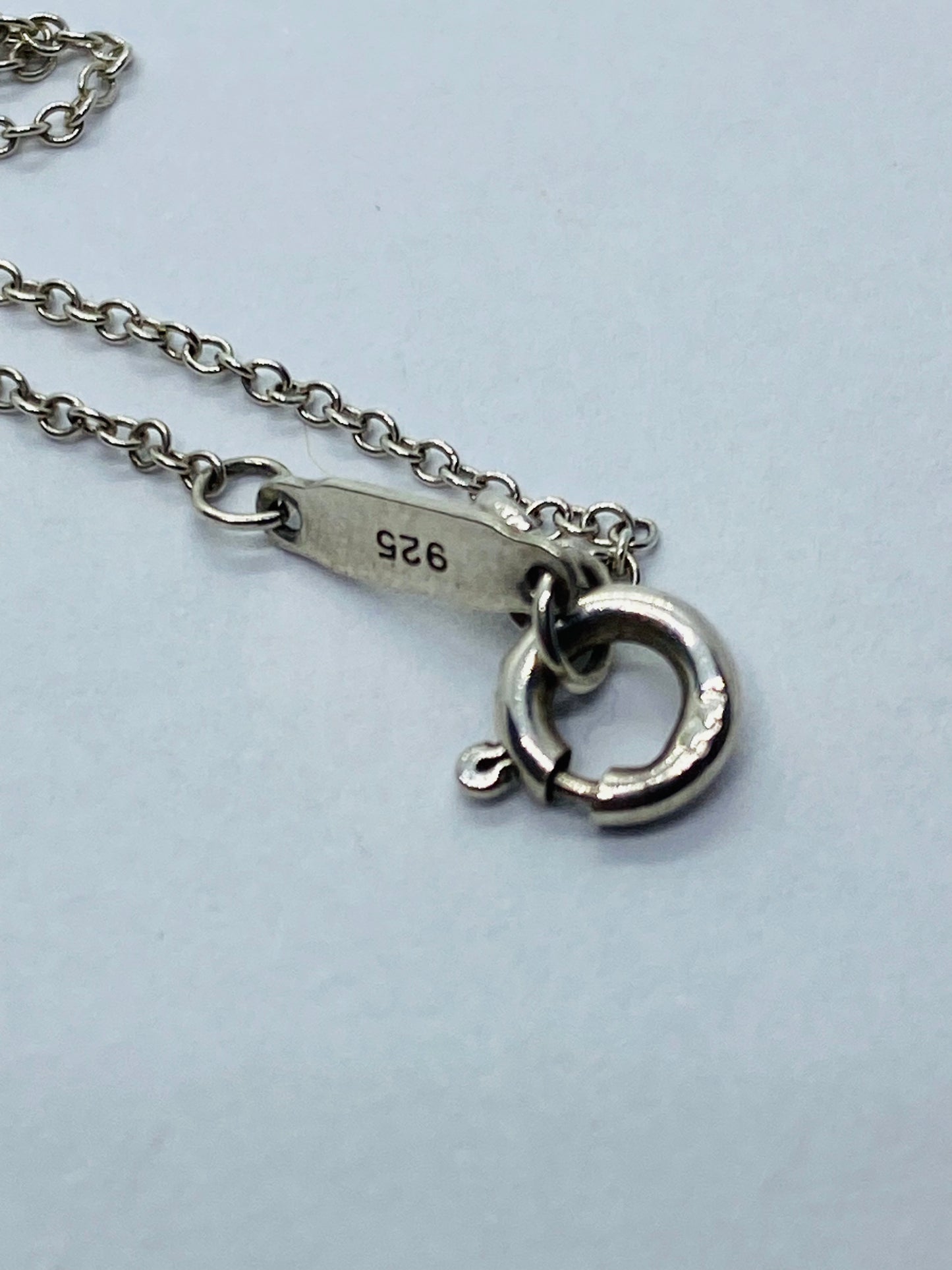Return to Tiffany & Co. Blue Enamel Font/Writing Heart Charm Sterling Silver