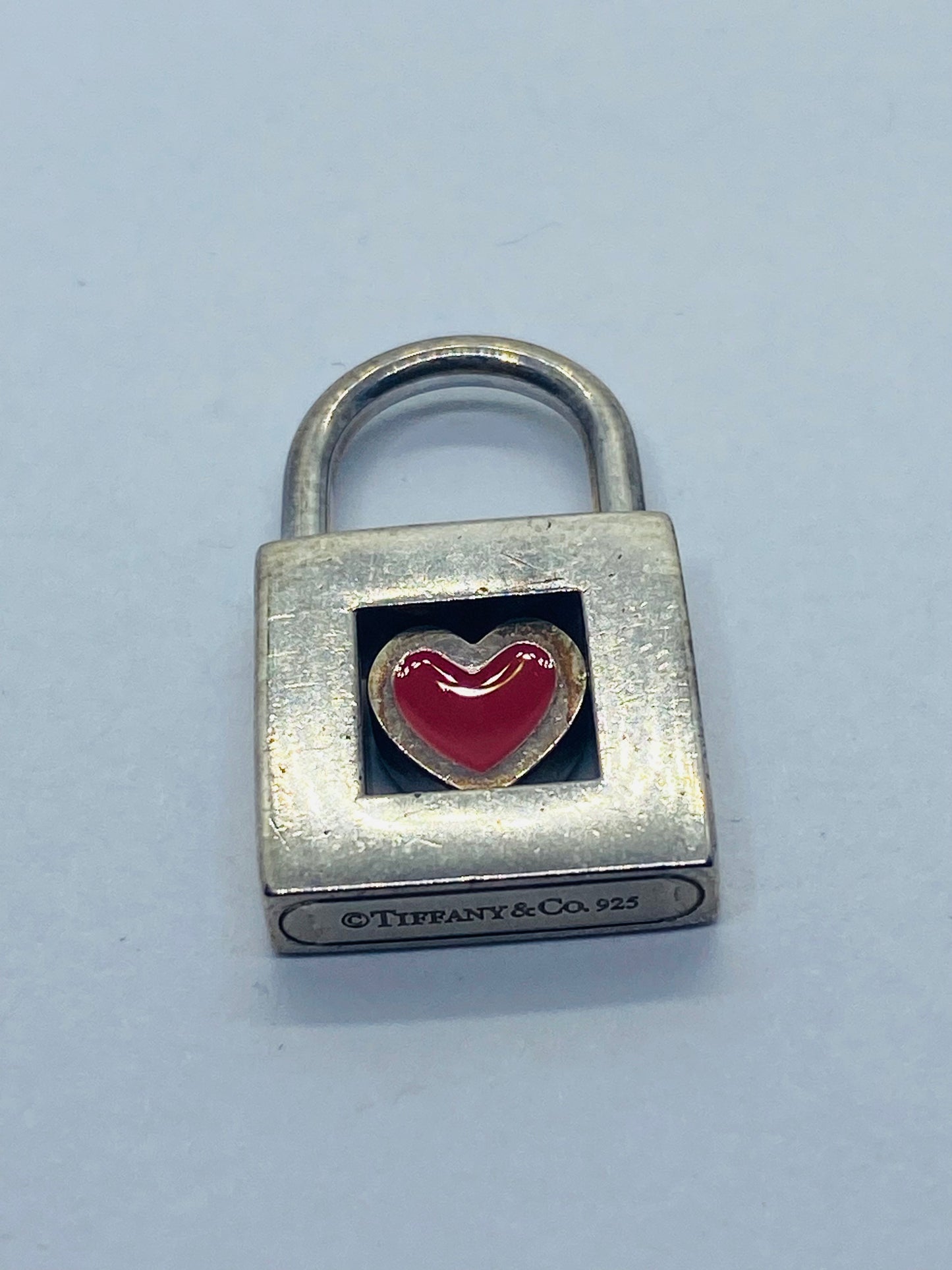 TIFFANY & CO. Red Heart Padlock Charm Sterling Silver Pendant.
