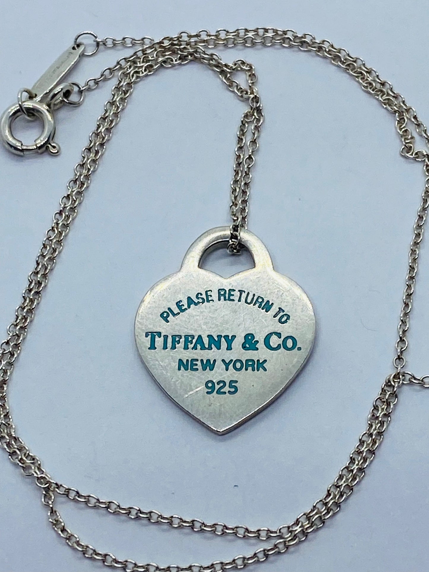 Return to Tiffany & Co. Blue Enamel Font/Writing Heart Charm Sterling Silver