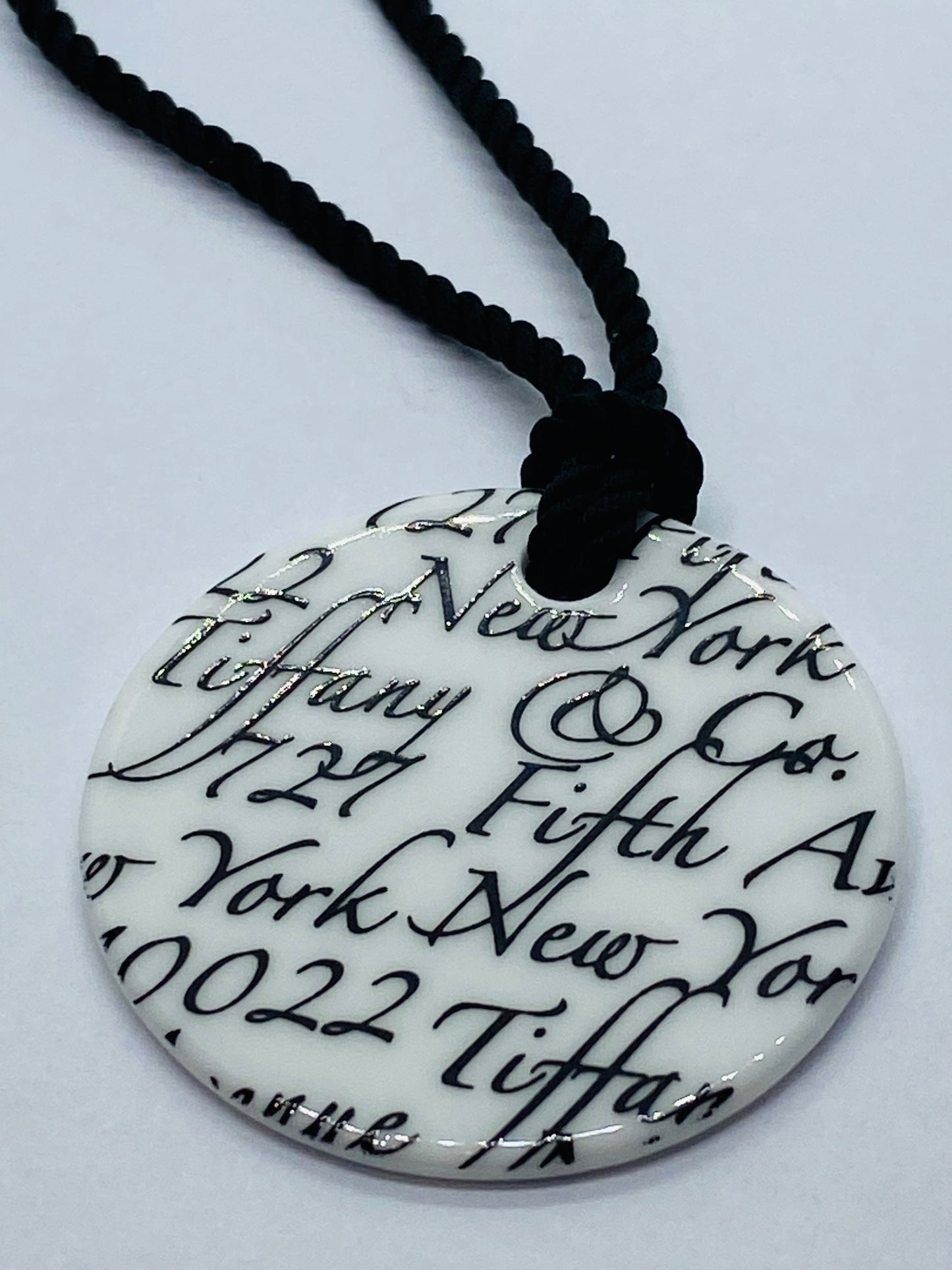 Tiffany & Co White Bone Script New York Fifth Ave Round Silk Cord 16" Necklace