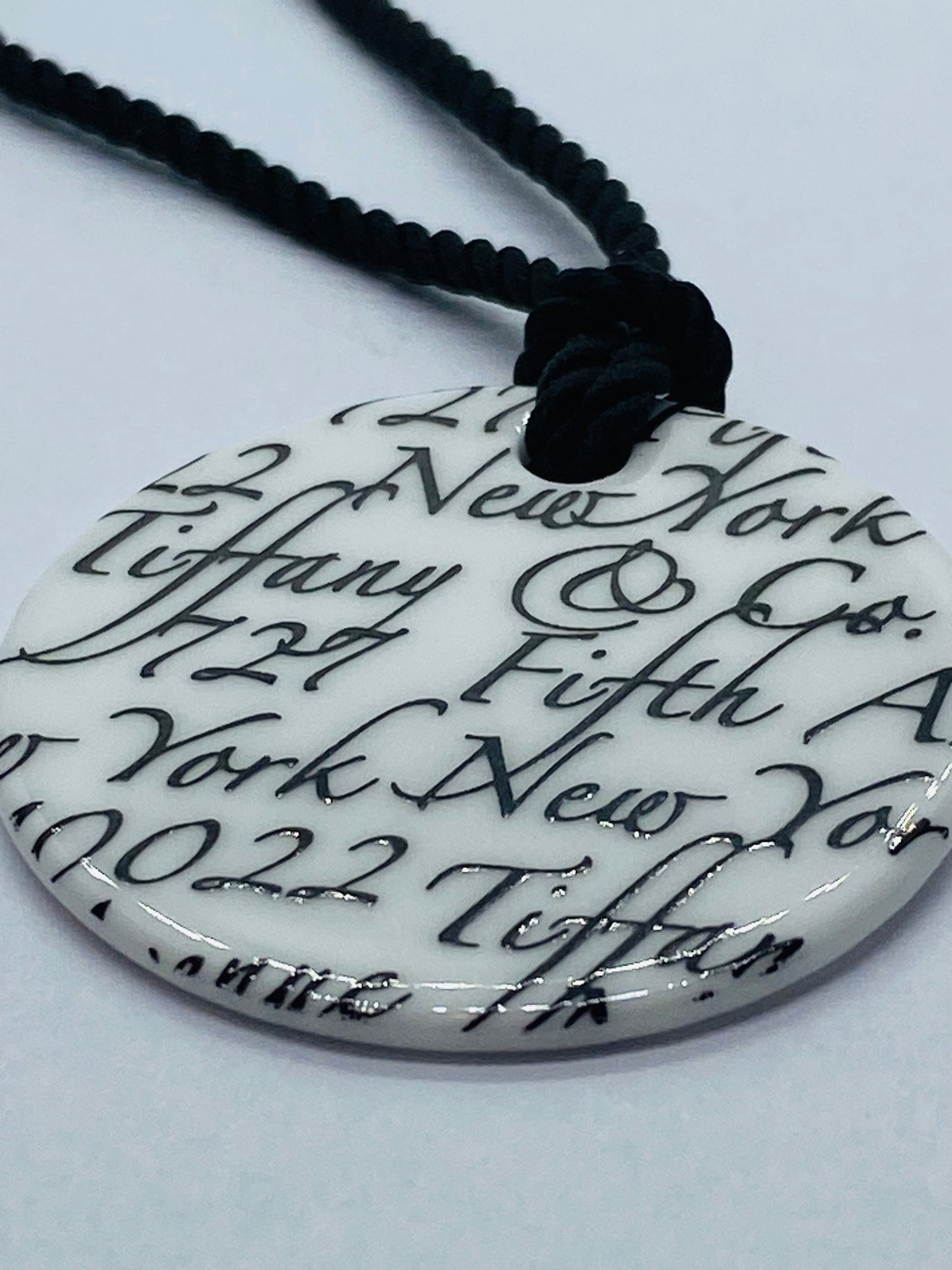 Tiffany & Co White Bone Script New York Fifth Ave Round Silk Cord 16" Necklace