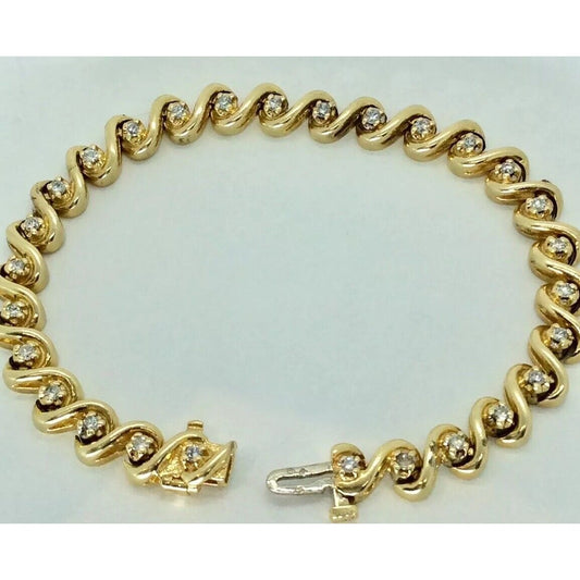 1.2 TCW 14k Gold S link diamond tennis bracelet 7" Excellent condition 25 Grams!